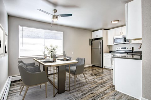 a kitchen and dining area in a 555 waverly unit